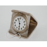 A silver travel clock with 8-day movement, Birmingham 1922, 6.5 x 5.5cm Condition Report: