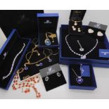 A collection of items by Swarovski to include a classic swan necklace, and other items Condition