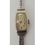 A ladies 9ct white gold vintage Rolex with a Chromed metal strap, weight together with the mechanism