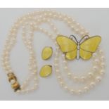 A Norwegian silver butterfly brooch and earrings by Holth, and a double string of cultured pearls
