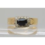 A 9ct gold sapphire and diamond oblong cluster ring, set with 0.20cts of eight cut diamonds size