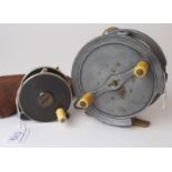 A Westley Richards & Co Rolo 4 1/4in fly reel and a Robertson 2 1/2in. reel with nickel rims in