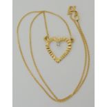 An 18ct gold diamond set heart pendant necklace, length of chain 40cm, weight 3.6gms Condition
