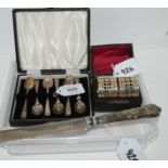 A lot comprising a cased set of six silver coffee spoons, Sheffield 1959, a pair of white-metal