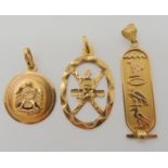 An 18k Italian made golden hawk pendant, diameter 2.1cm, together with two Arabic gold pendants
