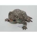 A white-metal musical frog desk weight by Reed & Barton, 8cm long Condition Report: Available upon