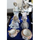 Lladro figure of a girl carrying dogs, a lady carrying calla lilies, a girl in dress, a Nao figure