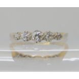 An 18ct five stone diamond ring, set with estimated approx 0.17cts, size M1/2, weight 2.3gms