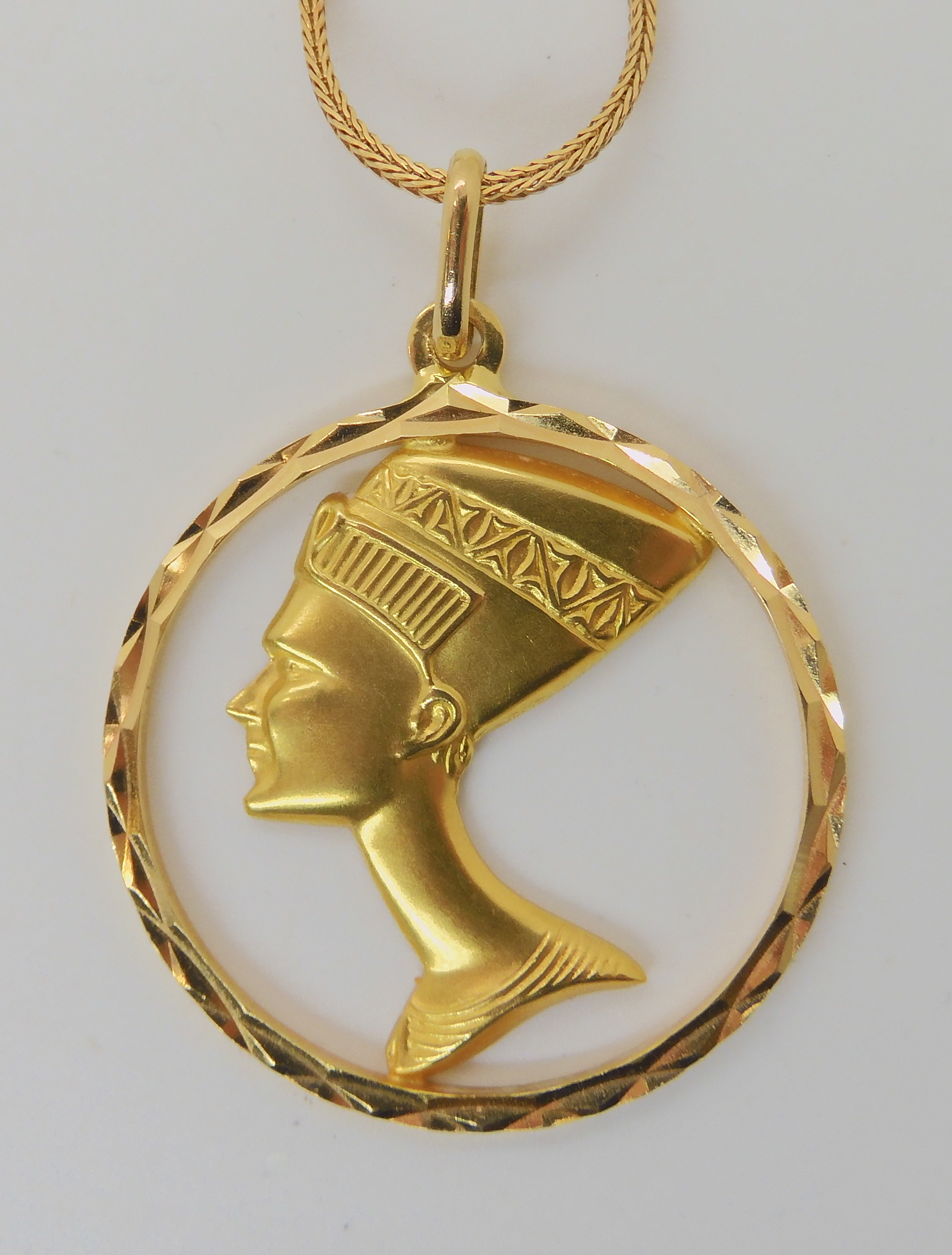 A 18k Nefertiti pendant diameter 3.5cm, on an 18ct gold Italian herringbone chain length 60cm - Image 2 of 2