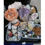 A selection of semi precious stones, crystals and geodes including amethyst, rose quartz, tigers