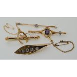 Four 9ct gold brooches aquamarine, wishbone, lily of the valley and one set with amethyst, weight