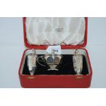 A cased three-piece silver condiment set, 1933, 195gms Condition Report: Available upon request