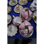 A Royal Doulton pink, white and gilt teaset Condition Report: Available upon request