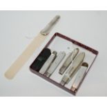 A lot comprising five mother of pearl fruit knives and a cased miniature knife with a silver handled