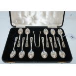 A cased part set of eleven silver coffee spoons with tongs, Sheffield 1938