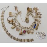 A silver charm bracelet and other items Condition Report: Not available for this lot
