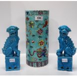 A pair of turquoise glazed fo dogs and a cylinder vase Condition Report: Available upon request