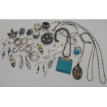 A silver and turquoise Navajo ring by Running Bear, a pair of silver Kelpie earrings and other items