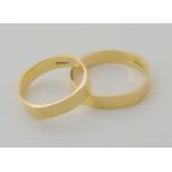 Two 18ct gold unusual shaped wedding rings, size N and S1/2 weight together 6.4gms Condition Report: