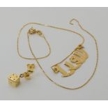An 18ct gold Arabic name pendant necklace and a single dice earring, weight together 4.6gms