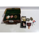 A lot comprising various nursing medals & badges & a small leather case Condition Report: