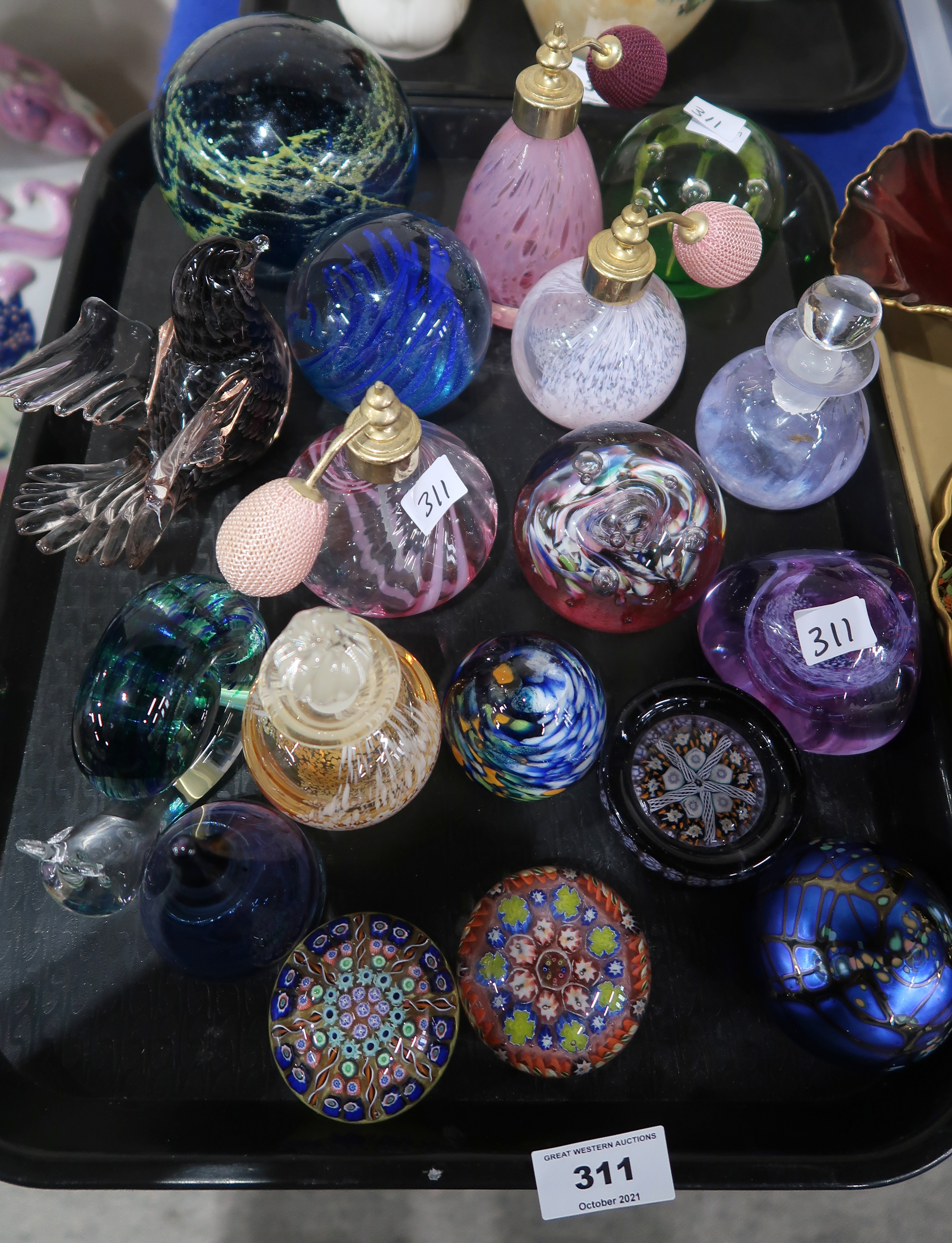 A lot comprising a Colin Heaney iridescent paperweight, millefiori paperweights, a Wedgwood glass