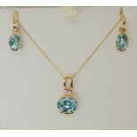 A 14k gold aqua coloured gemstone and diamond pendant and matching earrings, weight together 6.