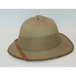 A pith helmet and soft leather brief case Condition Report: Available upon request