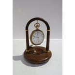 A rolled gold Waltham pocket watch on stand Condition Report: Available upon request