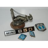 A car mascot and Mini car badges Condition Report: Available upon request