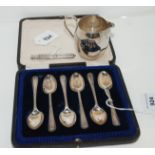 A lot comprising a cased set of six silver coffee spoons, Sheffield 1919, s silver cream jug, London