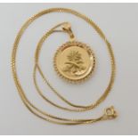 An 18ct gold double sided Saudi Arabian pendant and chain length 60cm, weight 11.3gms Condition
