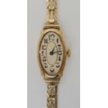 A 9ct Art Deco ladies watch and strap, weight including mechanism 14.3gms Condition Report: Winds