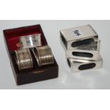 A lot comprising three silver napkin rings and three silver matchbox holders, 181gms Condition
