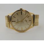 A 9ct gold gents Accurist watch head hallmarked Birmingham 1964, with gold plated expanding strap,