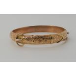 A 9ct rose gold buckle shaped bangle, hallmarked Birmingham 1864 weight 10.8gms Condition Report: