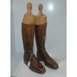 A pair of brown leather boots with stretchers, approx 30cm long Condition Report: Available upon