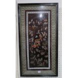 A framed Chinese embroidered silk panel depicting a festival scene, 37 x 68 cm Condition Report: Not