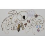 A collection of silver and white items to include bangles, rings pendants etc Condition Report: