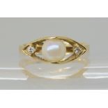 A 14k gold retro pearl and diamond ring, size Q, weight 3.5gms Condition Report: Available upon