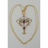 A 9ct gold garnet and pearl Edwardian pendant and chain, weight 3gms Condition Report: Available