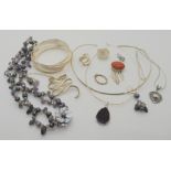 A silver bangle, rings and other items Condition Report: Not available for this lot