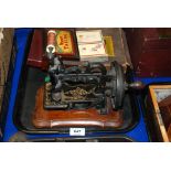 A hand crank sewing machine, various playing cards etc Condition Report: Available upon request