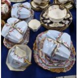 A Shelley lady artist painted teaset comprising thirteen cups, twelve cups and saucers, eleven