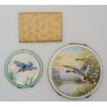 A large silver compact enamelled with ducks in flight, together with a smaller example enamelled