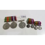 A group of three WW2 medals with four miniatures Condition Report: Available upon request