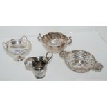 A lot comprising three silver bon bon dishes assorted marks and a silver cream jug, London 1911,