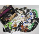 A collection of vintage costume jewellery to include a carved amber bracelet (af) Ciro faux pearls