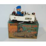 A battery operated tinplate Mystery Police Car by Nomura (TN Toys) 25cm long in original box
