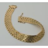 A 9ct gold bark pattern bracelet, length 20.5cm, weight 26.3gms Condition Report: One link will need